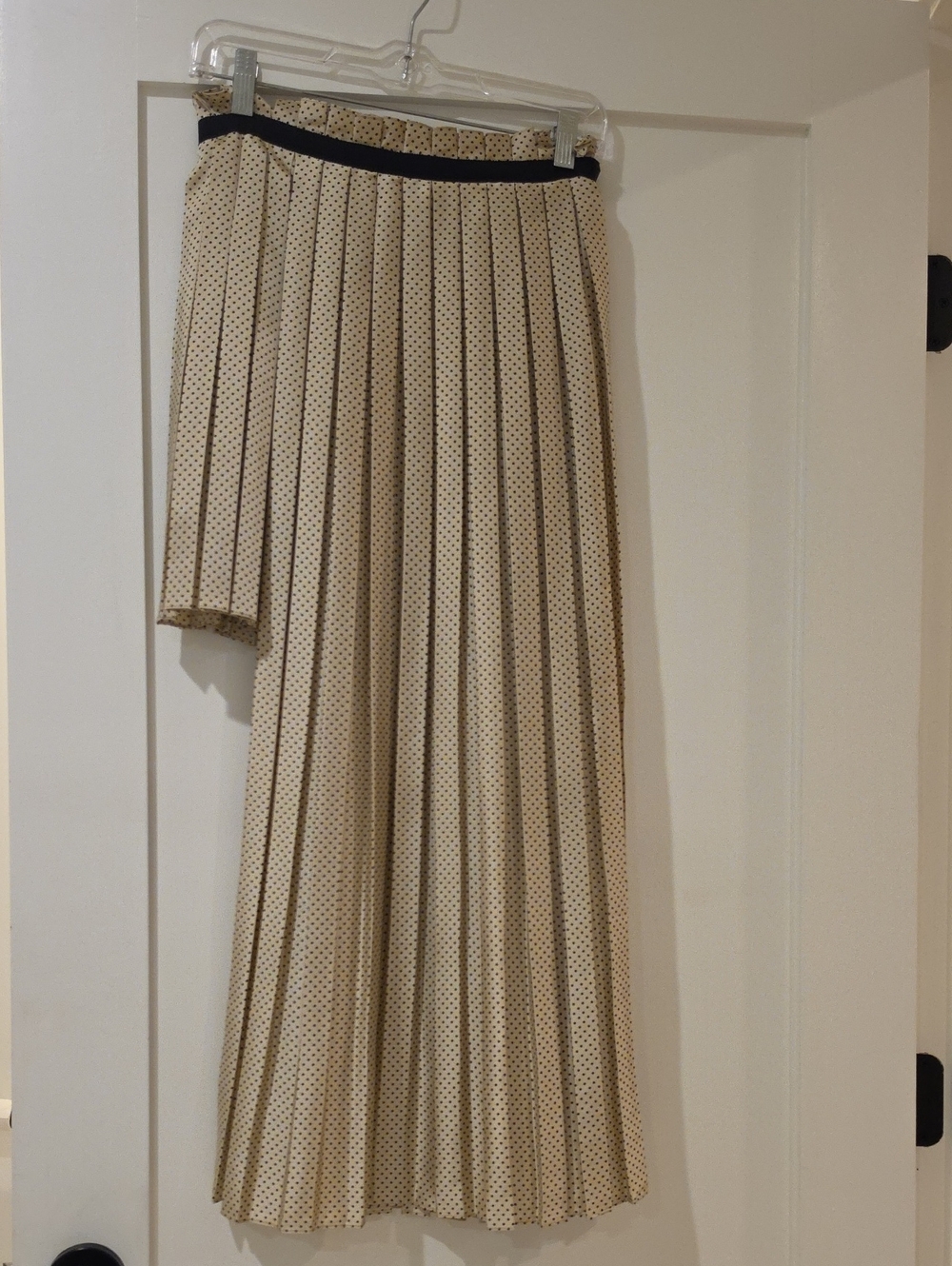Zeta Ville Cream Polka Dot Asymmetrical Pleated Skirt with Black Waistband